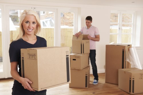 Moving team transporting furniture through a London neighborhood