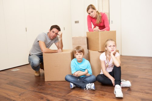 Professional movers in West Hampstead packing fragile items