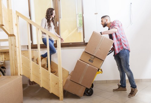 Commercial movers packing office furniture and technology for relocation