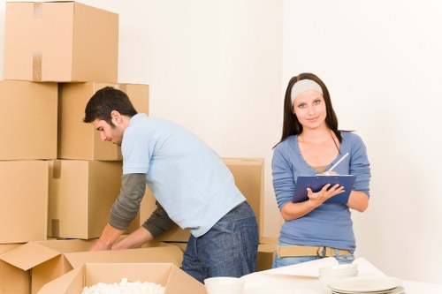 A moving team handling furniture for a Westhampstead house relocation