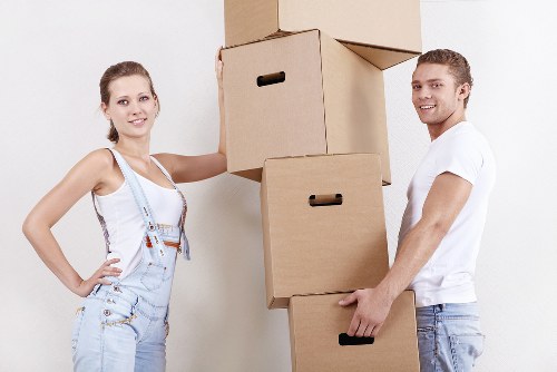 Professional movers unpacking household items in a Westhampstead property
